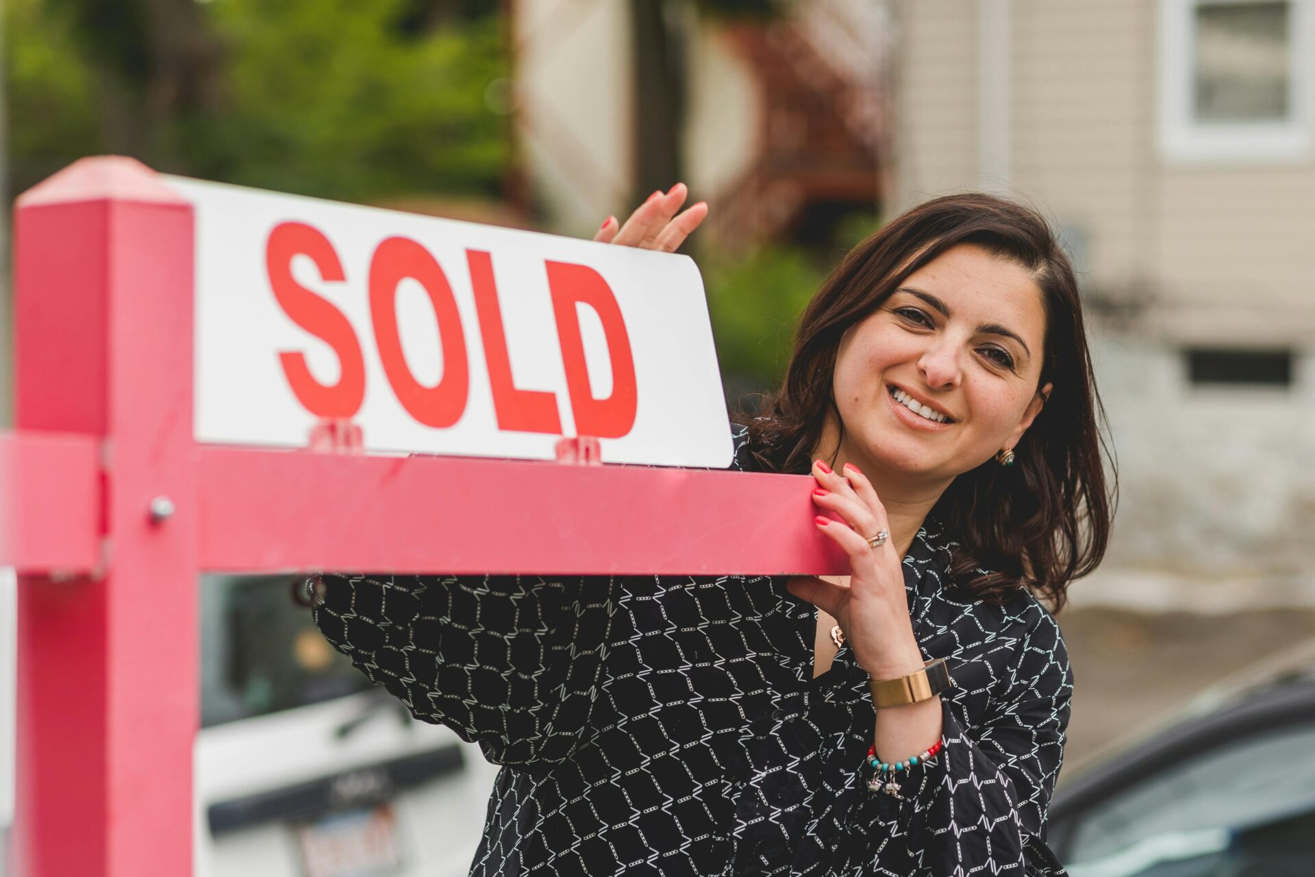Woman-with-sold-sign